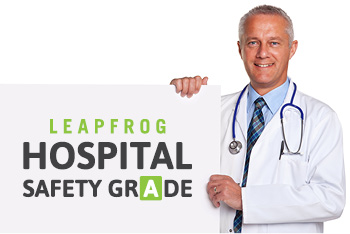Doctor holding Hospital Safety Grade sign